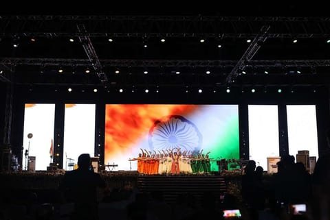 Artists performing on stage at the Har Ghar Tiranga event
